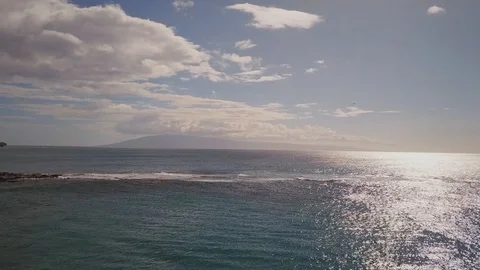 Excitcing shot of blue pacific ocean under cloudy sky on island maui,hawaii Stock Footage 100516543