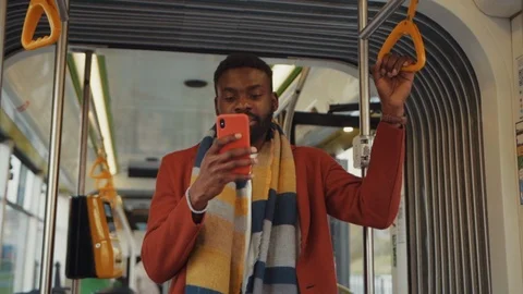 Excited afro-american man learning successful news on smartphone driving inside Stock Footage 121476077
