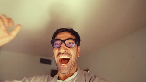 Excited and laughing man taking a selfie Stock Footage 305034604