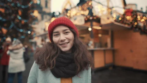 Excited beautiful happy young asian woman portrait in winter hat smiling at Stock Footage 254124853