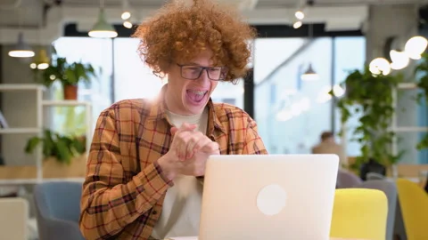 Excited blogger or programmer checking email reading great news on laptop Stock Footage 221157560