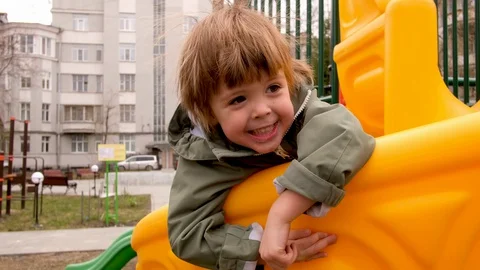 Excited boy playing on playground Stock Footage 129648957