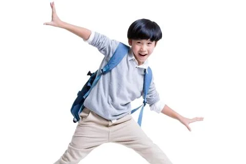 Excited boy with schoolbag on back Foto stock