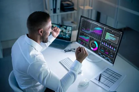 Excited Business Analyst Using Data Dashboard On Computer Stock Photos