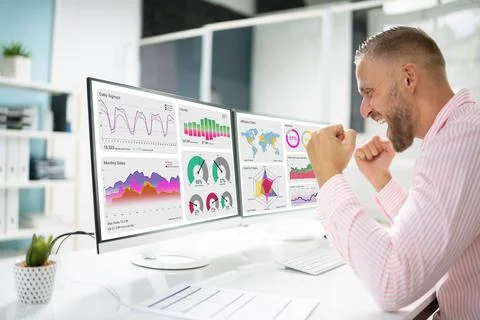 Excited Business Analyst Using Data Dashboard On Computer Foto stock