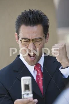 Excited Businessman Reading Text Message Stock Photos
