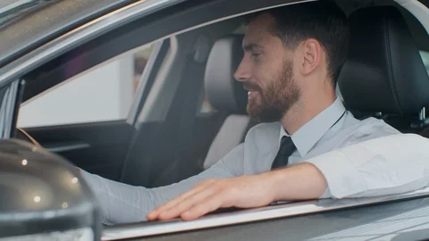 Excited customer in car interior. 스톡 동영상 108802489
