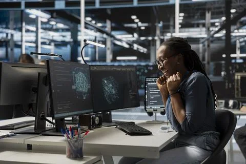 Excited engineer in data center celebrating successful AI implementation Stock Photos