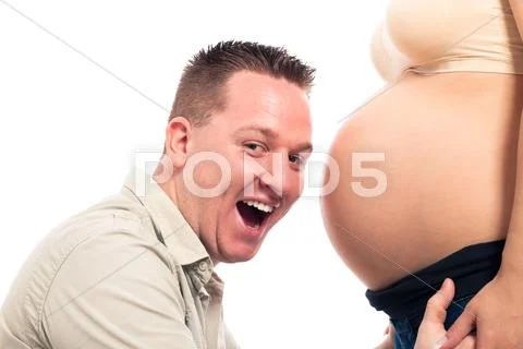 Excited expectant father and pregnant belly Stock Photos
