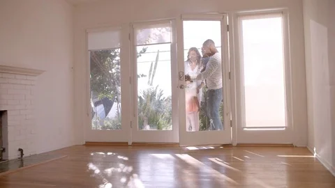 Excited Family Explore New Home On Moving Day Stock Footage