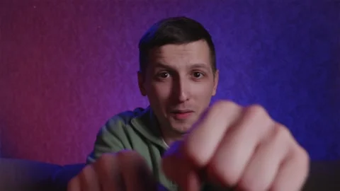 Excited fan shadow boxing while celebrating victory Stock Footage 333756940