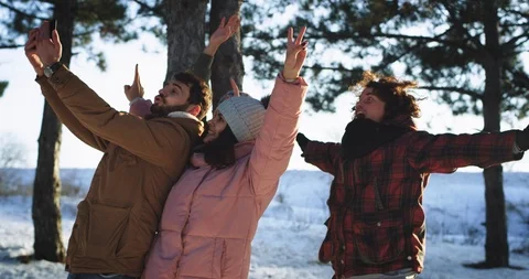 Excited group of friends taking a fun selfies for memories in a winter day with Stock Footage 111824933