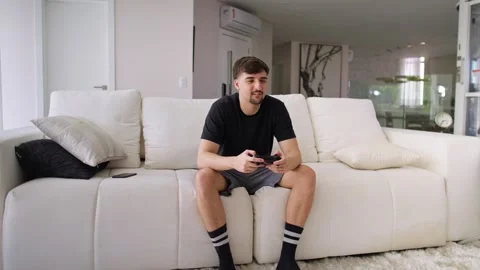 Excited guy playing video game and using joystick. Stock Footage 248665520