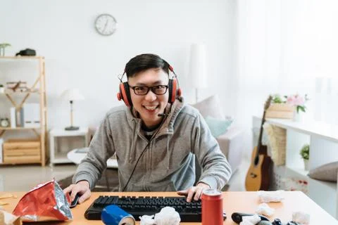 Excited guy smiling face camera as looking screen Stock Photos