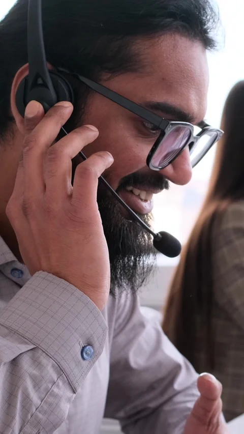 Excited It Support Worker Conducting Remote Conversation In The Office Stock Footage 303933751