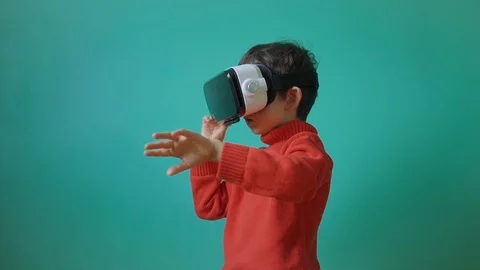 Excited little kid using virtual reality glasses Stock Footage 104925570