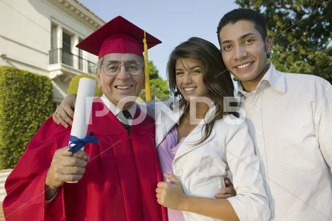 Excited Male Graduate With Family Stock Photos