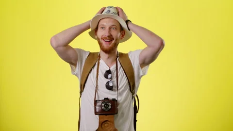 Excited Man With Backpack, Hat And Camera Happy Tourist Looks Around And Admires Stock Footage 170186704