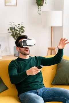 Excited man exploring virtual reality Stock Photos