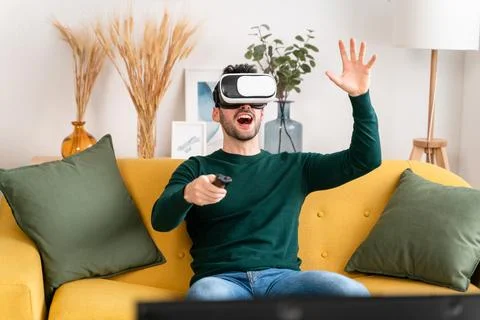 Excited man exploring virtual reality Stock Photos