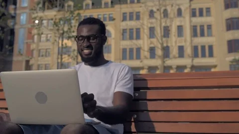 Excited man finishing work and drinking coffee Stock Footage