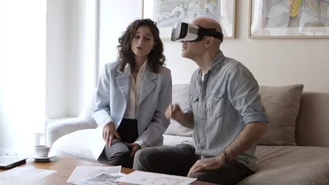 Excited man looking at interior design via VR technology Stock Footage 121004582