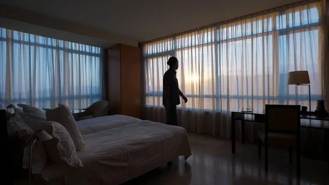 Excited Man sit down on bed Stock Footage 125184988