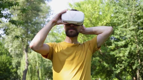 Excited man taking off vr headset and showing thumb up Stock-Footage 136113720