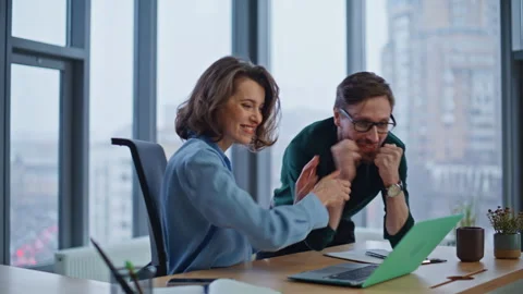 Excited managers celebrating success looking laptop at office workplace closeup. Stock Footage 340528446