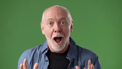 Excited Middle-Aged Man Expressing Joy in Front of a Green Screen Backdrop Stock Footage 311117111