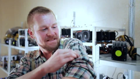 Excited miner with bitcoin Stock-Footage 85683540
