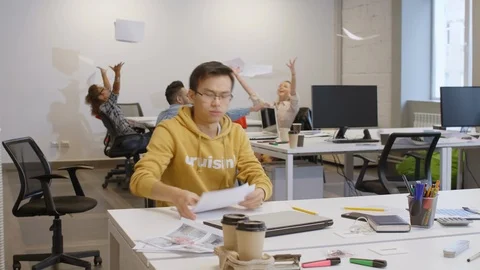 Excited Multiethnic Colleagues Throwing Papers and Leaving Office Video stock 126140843