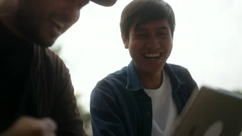 Excited two young handsome man watching and cheering sports games on tablet. 库存影片 233238207