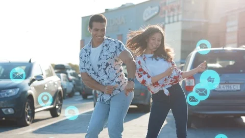 Excited young couple dancing dance in sunlight around blue animation сloud Stock Footage 126791638