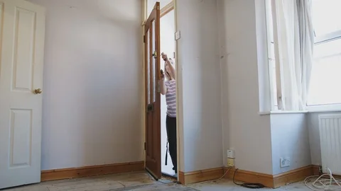 Excited Young Couple Opening Front Door Of New Home Stock Footage 102360153