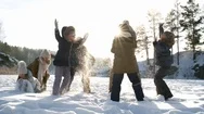 Excited Young Family Tossing Up Snow Stock Footage