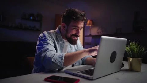 Excited young freelance man checking email great news on laptop. Male amazed Stock Footage 256514835