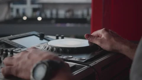 Exciting DJ Mixing Session on the Rooftop Featuring Modern Audio Equipment and Video stock 302173009