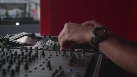 Exciting DJ Mixing Session on the Rooftop Featuring Modern Audio Equipment and Video stock 302173257
