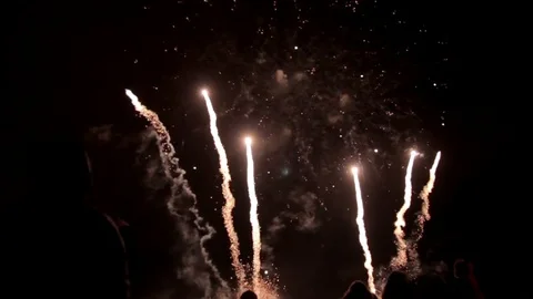 Exciting fireworks performance above people heads Stock Footage 74734603