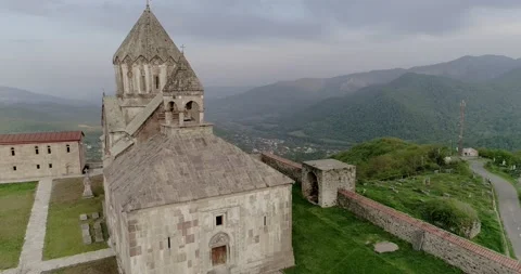 Exciting flight over medieval temple gandzasar close to belfry to mountain v Video stock 130519301