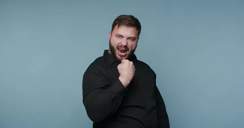 Exciting moments captured in expression as a man celebrates the thrill of v.. Stock-Footage 329111565