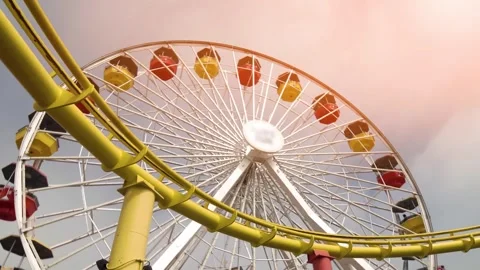 Exciting Roller Coaster Ride at Sunset in Amusement Park Stock Footage 302228473