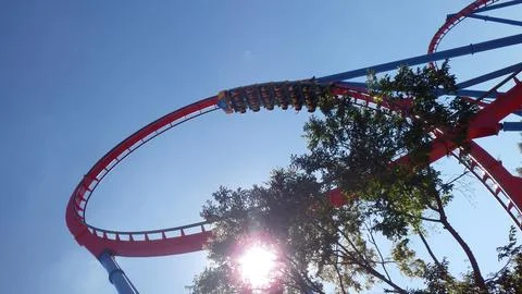 Exciting roller coaster ride under bright sunlight Stock Photos