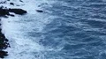 Exciting seascape, slow-motion of foamy waves crashing into cliff stones HD Footage