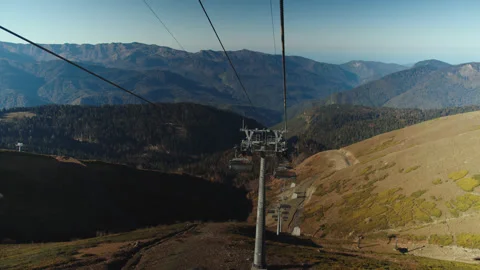 Exciting view on caucasian mountain range from cable car moving down. Travelling Stock Footage 204047573