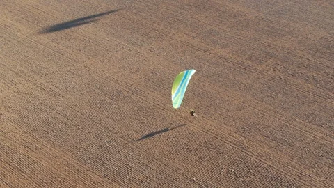 Exciting view of two paramotor fying and gliding in the air having fun in Stock Footage 117129887