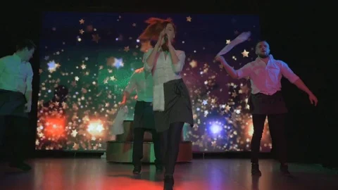 Exciting young actors dance and sing on stage in night club Video stock 80253275