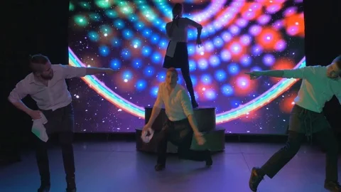 Exciting young actors dance and sing on stage in night club Video stock 80254066