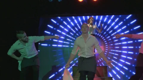 Exciting young actors dance and sing on stage in night club Video stock 80255197